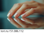 Perfectly manicured hand reflecting on a smooth surface in a well-lit indoor setting during daytime. Generative AI. Стоковое AI-изображение, AI-художник Katsiaryna Repich / Фотобанк Лори