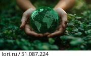 Hands holding a green globe symbolizing environmental care and renewal. Стоковое AI-изображение, AI-художник Katsiaryna Repich / Фотобанк Лори
