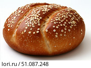Freshly baked multigrain round loaf topped with oats ideal for healthy meals or snacks. Generative AI. Стоковое AI-изображение, AI-художник Katsiaryna Repich / Фотобанк Лори