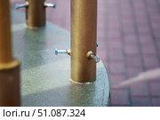 Metal pipe with three bolts securing a smaller diameter pipe inside, showcasing industrial fastening and mechanical construction. Стоковое фото, фотограф Татьяна Степанищева / Фотобанк Лори