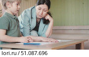 Mom education son writing. Kids learn and study in home school. Mommy female helping teaching little boy support studying, learning homework. Child care teach study. Knowledge day. Children schooling. Стоковое видео, видеограф Марина Демидюк / Фотобанк Лори