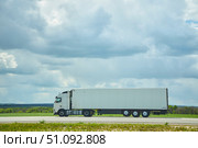 Highway M4 Russia - May 10, 2022: Long truck on the highway. Transportation services. Редакционное фото, фотограф Наталия Кирсанова / Фотобанк Лори