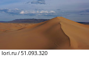 Aerial view of sand dunes in desert at sunset. Стоковое фото, фотограф Михаил Коханчиков / Фотобанк Лори