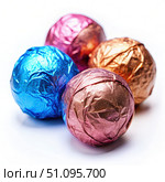 Colorful Round Pralines Wrapped in Shiny Foil. Generative AI. Стоковое AI-изображение, AI-художник Roman Zavorotny / Фотобанк Лори
