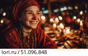 Joyful character in a lively medieval tavern during a festive gathering. Стоковое AI-изображение, AI-художник Ксения Лаптева / Фотобанк Лори