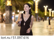 At night, smiling girl walks around old city district Barceloneta, in vicinage of Citadel Park. Стоковое фото, фотограф Яков Филимонов / Фотобанк Лори