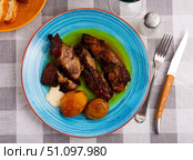 juicy and fatty fried pork ribs with crust, seasoned with coarse salt. Стоковое фото, фотограф Яков Филимонов / Фотобанк Лори