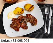 Grilled lamb thigh and potatoes served in a plate. Стоковое фото, фотограф Яков Филимонов / Фотобанк Лори