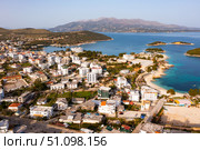 Drone view of Albanian resort of Ksamil on coast of Ionian sea. Стоковое фото, фотограф Яков Филимонов / Фотобанк Лори