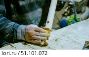 carpenter using nail gun or brad nailer tool on wood box in a workshop ,furniture restoration woodworking concept. selective focus. Стоковое фото, фотограф Feruza Tashmetova / Фотобанк Лори