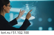 A professional analyzes various data presentations on a large interactive screen. Стоковое AI-видео, аниматор Данила Большаков / Фотобанк Лори