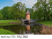 Slavyanka River and the Pill Tower Bridge in the Pavlovsky Palace and Park Complex on a summer day, Pavlovsk, Saint Petersburg, Russia. Стоковое фото, фотограф Ula Ulachka / Фотобанк Лори