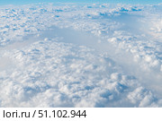 Aerial view capturing beautiful white clouds blanketing the earth on a sunny day, creating a serene and dreamlike atmosphere filled with soft, fluffy textures. Стоковое фото, фотограф Ольга Ильина / Фотобанк Лори