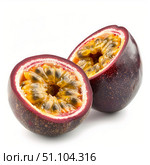 Two passion fruit halves showing ripe seeds and pulp. Стоковое AI-изображение, AI-художник Иван Рябоконь / Фотобанк Лори