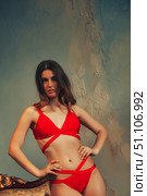 Crimson Confidence a Woman in Red Posing Indoors With Copy Space. Стоковое фото, фотограф Aleksandr Golubev / Фотобанк Лори
