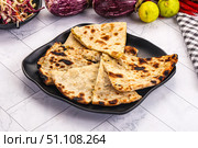 Indian stuffed potato bread Paratha. Стоковое фото, фотограф Андрей Старостин / Фотобанк Лори
