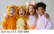 Group of happy children in animal costumes smiling together. Стоковое AI-изображение, AI-художник Olga Didraga / Фотобанк Лори