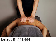 Releasing Tension Through Therapeutic Back Massage Session. Стоковое фото, фотограф Aleksandr Golubev / Фотобанк Лори