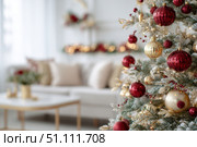 Christmas tree on a foreground, blurred festive living room on a background. Decorated red white tree in the apartment interior. Copy space, holiday spirit. Selective focus. Seasonal winter festivity. Стоковое AI-изображение, AI-художник Марина Демидюк / Фотобанк Лори