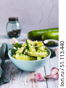 Lightly salted cucumbers with dill and garlic in a bowl on the table vertical view. Стоковое фото, фотограф Елена Руй / Фотобанк Лори