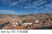 Panorama of the city in the mountains. There are many buildings with red tiled roofs in the valley and on the mountainsides. Dense buildings. The towers of the Catholic Cathedral are visible. Peru. Стоковое фото, фотограф Вера Ивановна Кубарева / Фотобанк Лори