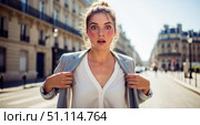 Heatwave in city background with sweating woman in summer, shocked female person feeling hot on street for climate change or global warming concept. Стоковое AI-изображение, AI-художник Павел Муравьев / Фотобанк Лори
