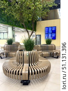 Rostov-on-Don, Russia - Waiting room with phone charging stations in the modern bus station of Rostov-on-Don. Public transport concept, intercity bus. Vertical shot. Редакционное фото, фотограф Ирина Михайличенко / Фотобанк Лори