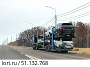 Car Service Transportation Concept. Tow Truck Transporting Car Or Help On Road Transports Wrecker Broken Car. Auto Towing, Tow Truck For Transportation Faults And Emergency Cars. Early winter day. Стоковое фото, фотограф Ирина Михайличенко / Фотобанк Лори