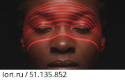 Laser scanning illuminating female face, capturing detailed biometric data in dark technological environment, exploring facial recognition precision. Стоковое AI-видео, аниматор Юрий Поздников / Фотобанк Лори
