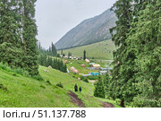 Traditional yurts and tourist houses in Barskoon Gorge valley, Kyrgyzstan. Редакционное фото, фотограф Ирина Кононова / Фотобанк Лори