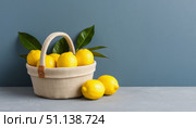 Lemons in a canvas basket on a blue background. Стоковое AI-изображение, AI-художник Анна Никонорова / Фотобанк Лори