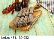Raw dry bukwheat soba noodles. Стоковое фото, фотограф Андрей Старостин / Фотобанк Лори