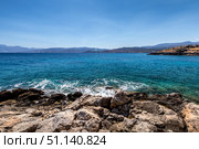 Agios Nikolaos coastline on a sunny day with clear sea and cliffs. (2019 год). Стоковое фото, фотограф Емельянов Евгений Викторович / Фотобанк Лори