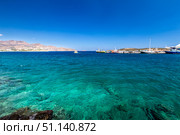 Agios Nikolaos coastline on a sunny day with clear sea and cliffs. (2019 год). Редакционное фото, фотограф Емельянов Евгений Викторович / Фотобанк Лори
