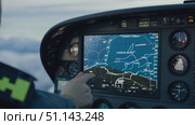 A pilot skillfully maneuvers a helicopter while monitoring navigation and weather data. Стоковое AI-видео, аниматор Данила Большаков / Фотобанк Лори