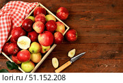 Autumn composition of apples in a box on a sunny wooden table, thanksgiving background, harvest, healthy natural food concept, detox diet and body cleansing, screen banner, cafe, restaurant, selective focus. Стоковое фото, фотограф Светлана Балынь / Фотобанк Лори