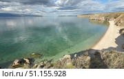 Baikal Lake on sunny summer day. Panoramic video of Small Sea and sandy beach of Olkhon Island. Picturesque landscape. Natural background. Summer travels and outdoor recreation. Стоковое видео, видеограф Виктория Катьянова / Фотобанк Лори