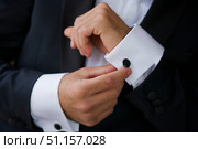 Men's hands correct shirt with cufflinks. Стоковое фото, фотограф Наталия Кирсанова / Фотобанк Лори