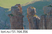 4k, A panoramic aerial view of the Two Monks rock on the Bolshoy Bermamyt plateau, North Caucasus, without people, at daytime, Stavropol Krai, Russia. Стоковое видео, видеограф Сергей Богомяко / Фотобанк Лори