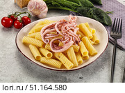 Italian cuisine - pasta tortiglioni with squid. Стоковое фото, фотограф Андрей Старостин / Фотобанк Лори