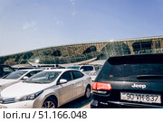 Baku, Azerbaijan, 29 August 2016, Cars are parked at the Heydar Aliyev airport. Редакционное фото, фотограф Spirit River / Фотобанк Лори