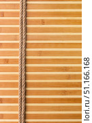 Frame of two smooth ropes lying on a bamboo mat. Стоковое фото, фотограф Александр Собко / Фотобанк Лори