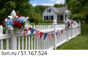 Patriotic blooms and bunting adorning white picket fence, highlighting classic american home celebrating national pride during summer holiday. Стоковое AI-изображение, AI-художник Юрий Поздников / Фотобанк Лори