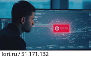 A professional examines intricate data on a high-resolution screen while immersed in a modern workspace. Стоковое AI-видео, аниматор Данила Большаков / Фотобанк Лори