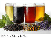 Glasses of tea with different types and colors infused with herbs, on a white background. The teas are green, black, red, purple, and yellow oolong, with loose leaf tea leaves with mint and lavender. Стоковое AI-изображение, AI-художник Марина Демидюк / Фотобанк Лори