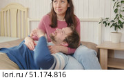 Loving mature couple interactions at home. Man and woman embracing, hugging, holding hands and dancing. Wife with husband intimate moments. couple is touching, cuddling, kissing. Natural lighting. 4K. Стоковое видео, видеограф Марина Демидюк / Фотобанк Лори