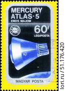 Saint Petersburg, Russia - November 12, 2020: Postage stamp issued in Hungary with the image of the Mercury - Atlas 5. From the series on Airpost. Spacecraft and Apollo Soyuz Emblem, circa 1975. Стоковое фото, фотограф Константин Тимофеев / Фотобанк Лори