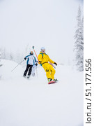 Sheregesh, Russia, 6 January 2017, Snowboarder skier sliding down snowy slope. Редакционное фото, фотограф Spirit River / Фотобанк Лори