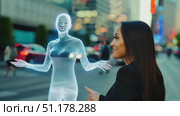 A woman admires a holographic figure while walking in a bustling urban area at sunset. Стоковое AI-видео, аниматор Данила Большаков / Фотобанк Лори