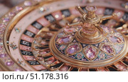 Experience the elegance of a luxurious roulette wheel in a glamorous casino setting. Стоковое AI-видео, аниматор Ekaterina Ismagilova / Фотобанк Лори